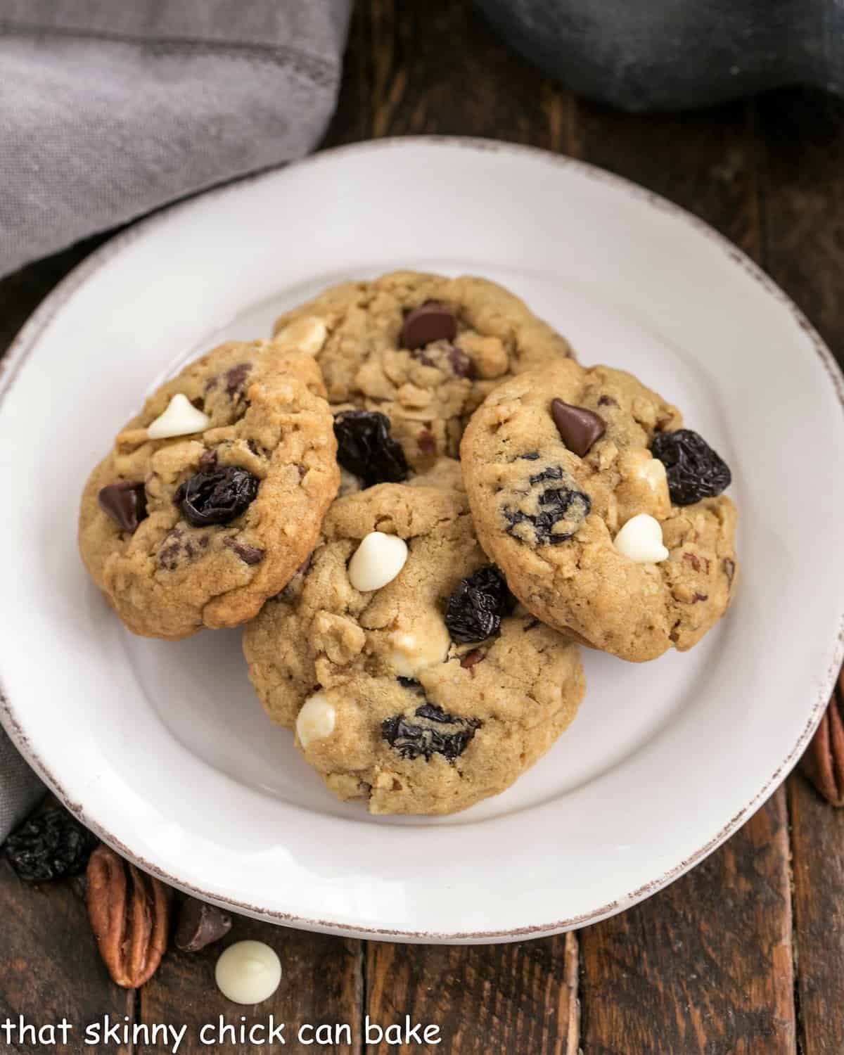 Overhead view of Chewy oatmeal cookies on a white plate.
