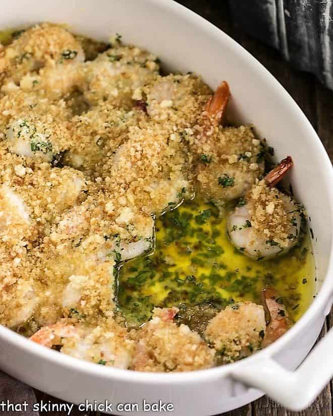Baked Garlic Shrimp - topped with bread crumbs and cooked in spicy, garlic butter, this easy recipe is perfect for dinner any night of the week! Baked Garlic Shrimp in a casserole dish.