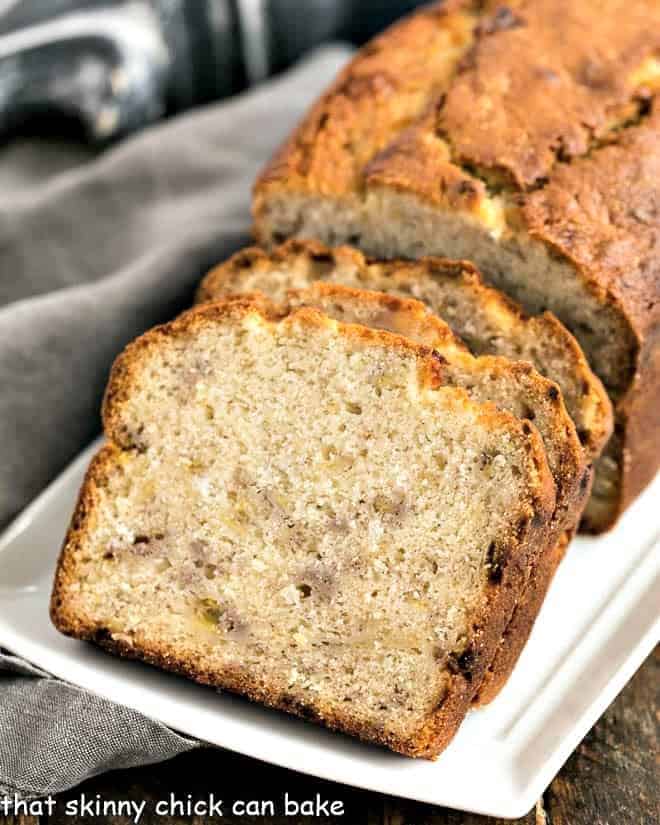Buttermilk Banana Bread slices on a white ceramic tray
