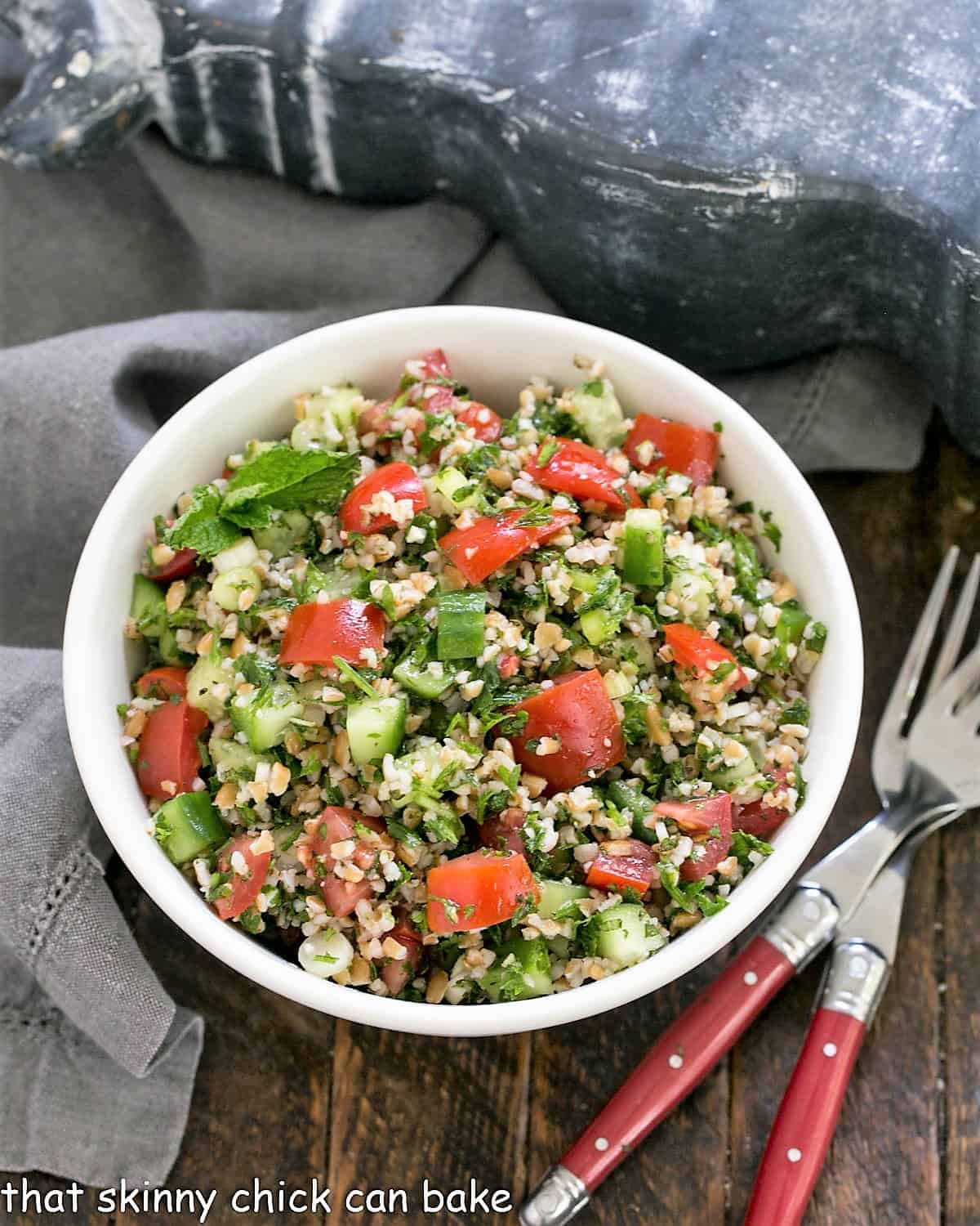 Overhead view Tabbouleh in a white serving bowl.