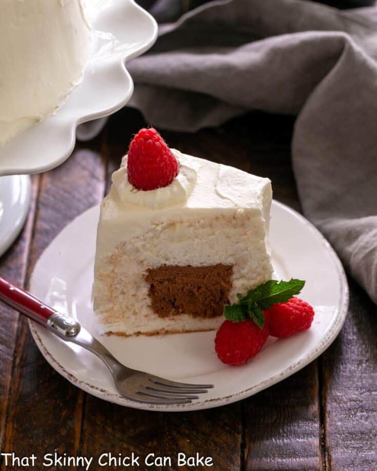Slice of Mousse Filled Angel Food Cake on a white dessert plate.