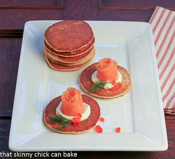 Buckwheat Blini with Smoked Salmon Roses - an elegant appetizer Buckwheat Blini with Smoked Salmon Roses on a white platter