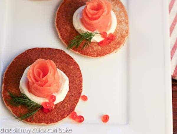 Buckwheat Blini with Smoked Salmon Roses - an elegant appetizer Overhead view of 2 Buckwheat Blini with Smoked Salmon Roses