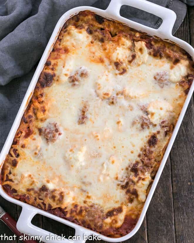 Ricotta Lasagna with Sausage in a white rectangular baking dish.