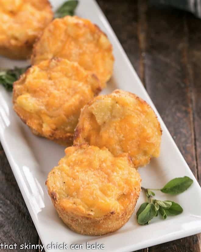 Cheesy Potato Cups on a white serving tray.