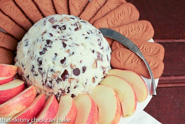 Chocolate Chip Cookie Dough Dip - A dreamy dessert dip filled with chocolate chips and toffee pieces! Chocolate Chip Cookie Dough Dip on a white plate with apple slices and cookies
