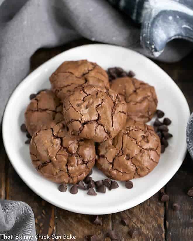 Chocolate Brownie Cookies with Mini Chocolate Chips on a white plate garnished with mini chocolate chips.