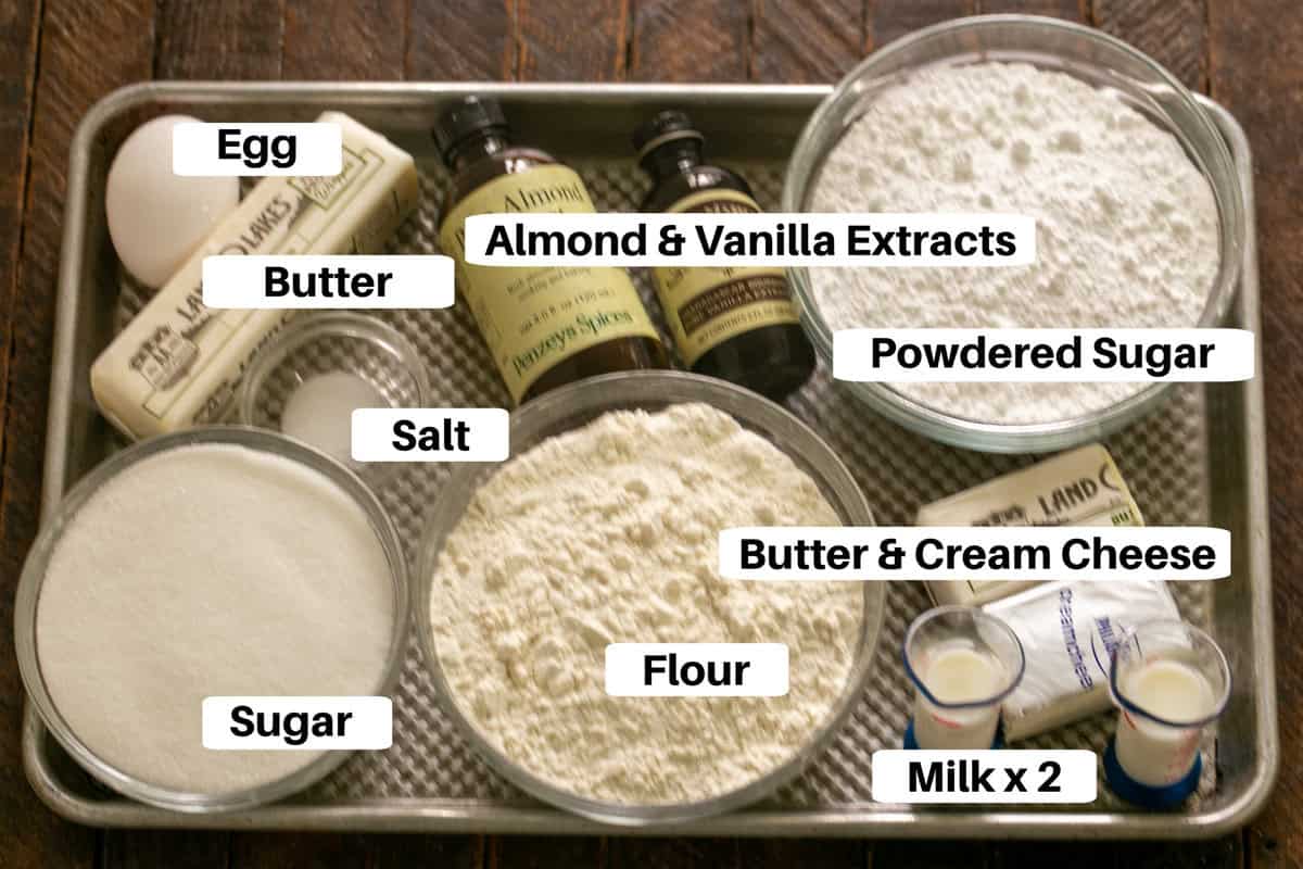 Sugar cookie bars ingredients on a sheetpan with labels.