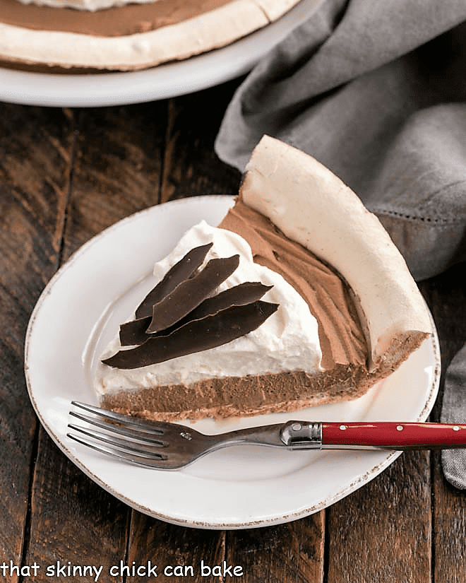 Slice of Chocolate Angel Pie on a white plate.