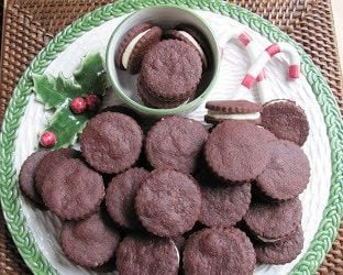 Overhead view of chocolate sandwich cookies on a holiday platter