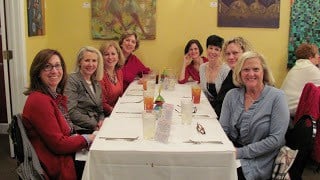Neighbor ladies around a table while out for lunch