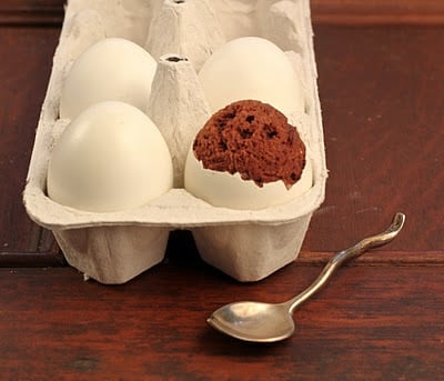 A bowl of food on a table, with Egg