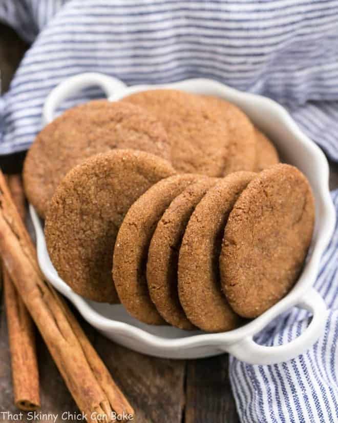Holiday Ginger Crisps in a white terrine with cinnamon sticks