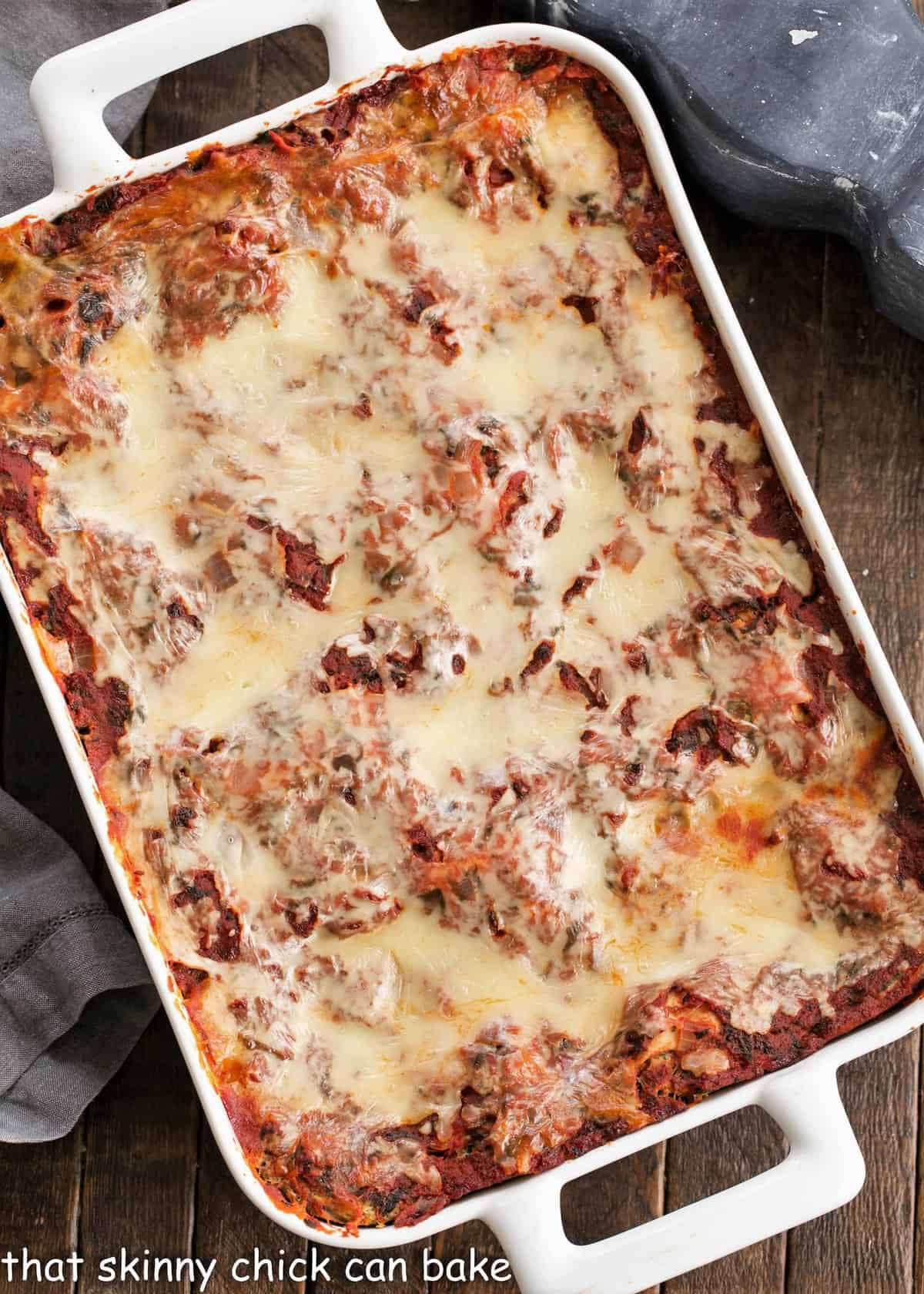 Overhead view of Spinach Lasagna in a white casserole dish