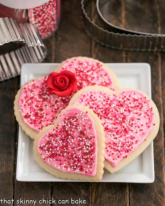 Lofthouse Sugar Cookies - the classic bakery cookie that can be baked up for any occasion! Frosted Sugar Cookies on a square white plate.