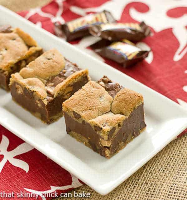 Fudge and Toffee Filled Chocolate Chip Bars on a white tray.