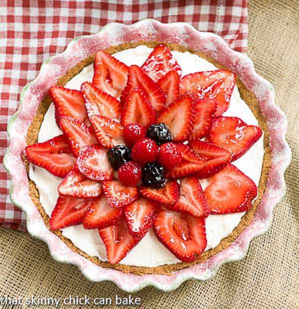Strawberry Cream Cheese Dessert | A dreamy cream cheese and whipped cream filling topped with juicy ripe strawberries!