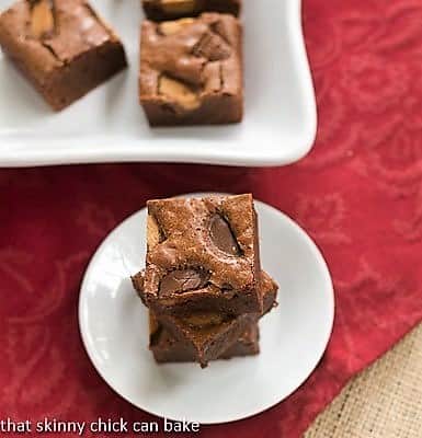 Fudgy Brownies with Reese's Chunks stacked on a small white plate