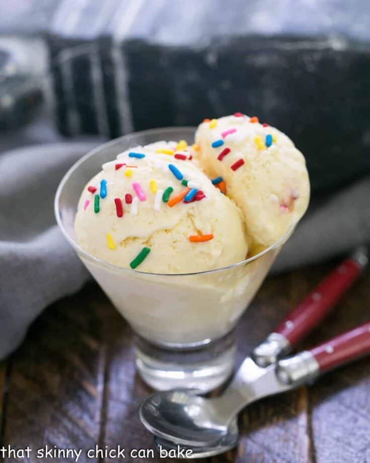 2 scoops of cake batter ice cream in a glass dish