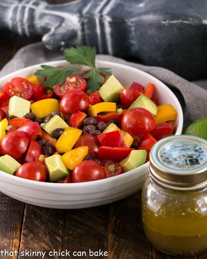 Avocado Salad with a jar of lime vinaigrette.