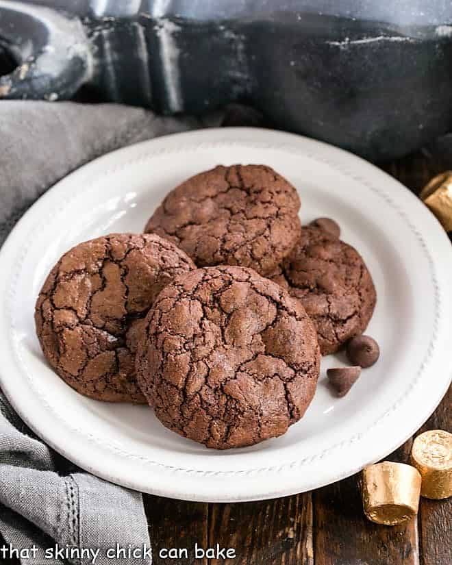 Rolo Brownie Cookies stacked on a white dessert plate.