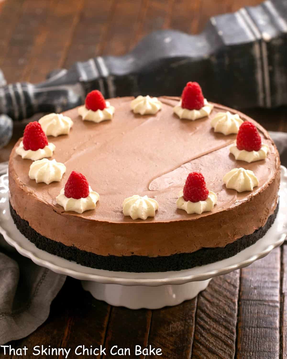 Chocolate Mousse Cake on a white ceramic cake stand.