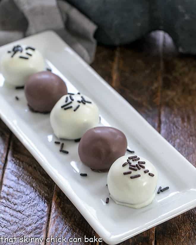 Oreo Balls on a narrow white tray.