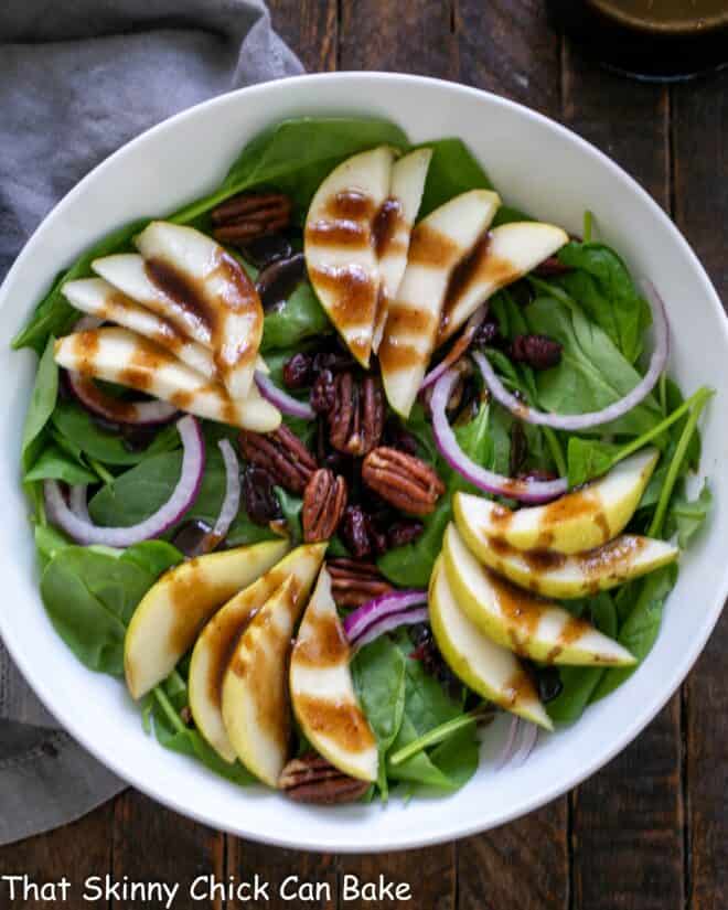 Overhead view of a Fall Salad in a round white bowl.