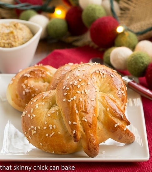 Homemade Challah Pretzels - Chewy pretzels made with eggy challah bread dough Homemade Challah Pretzels on a small white plate.