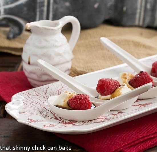 Balsamic Raspberries with Mascarpone Cream - an easy, elegant, bite sized dessert recipe Balsamic Raspberries with Mascarpone Cream in Chinese Soup Spoons on a red and white tray