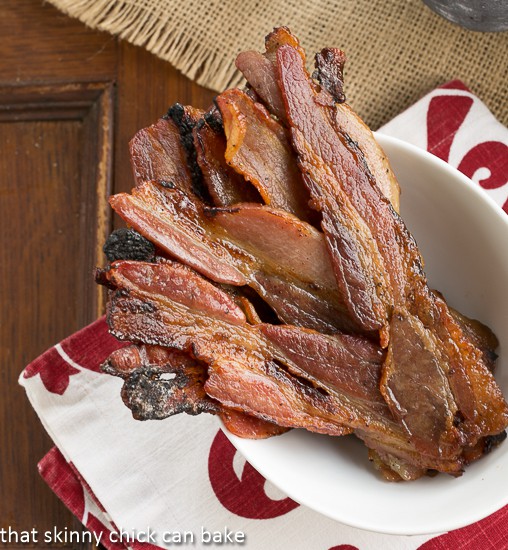 Candied Bacon AKA Pig Candy - a sweet salty treat that's equally as appropriate for breakfast as it is for an appetizer! Candied Bacon AKA Pig Candy in a bowl viewed from above.
