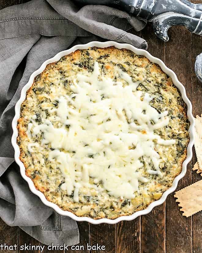 Overhead view of spinach dip in a round white dish
