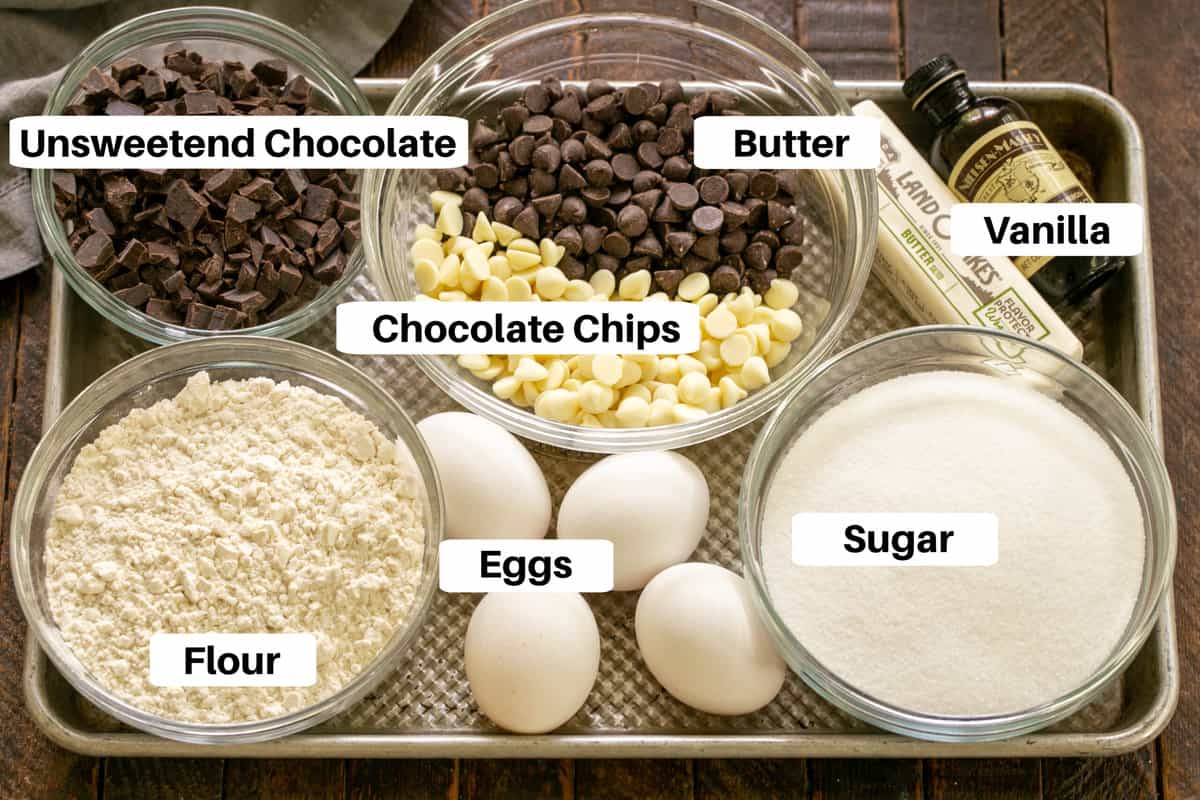 Brownie cookie ingredients with labels on a metal sheet pan.