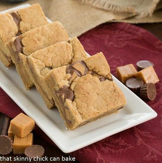 Chocolate Peanut Butter Bars lined up on a white tray