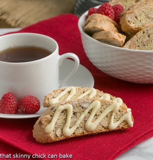 Cantuccini or Almond Biscotti perched next to a cup of hot tea.