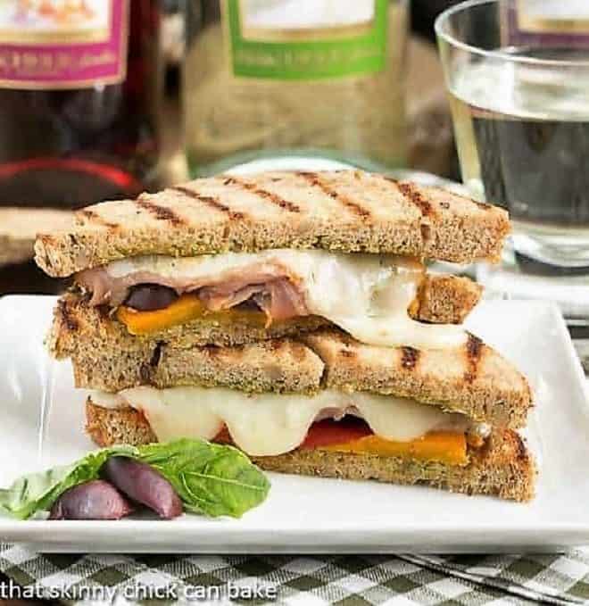 Mediterranean Grilled Cheese sliced and plated on a square white dish