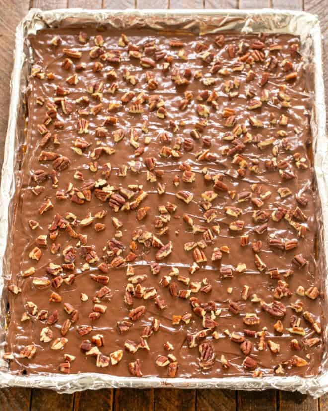 Add chocolate chips and spread, then add pecans.