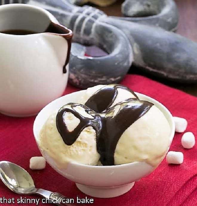 Dreamy, rich and luscious Fudge Topped Marshmallow Ice Cream is the perfect summer treat! Fudge Topped Marshmallow Ice Cream in a white dessert bowl
