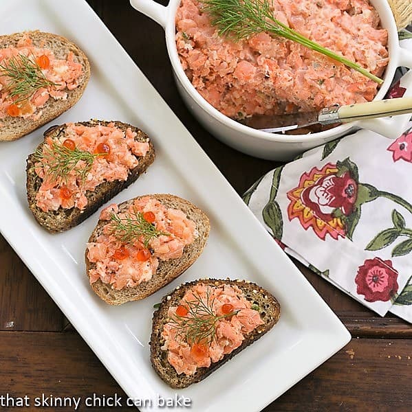 Salmon Rillettes on a white tray with a terrine of the salmon spread.