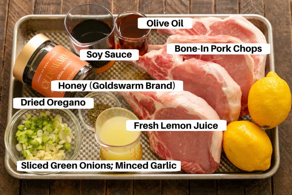 Soy, Honey & Lemon Marinated Pork Ingredients with labels on a sheetpan.