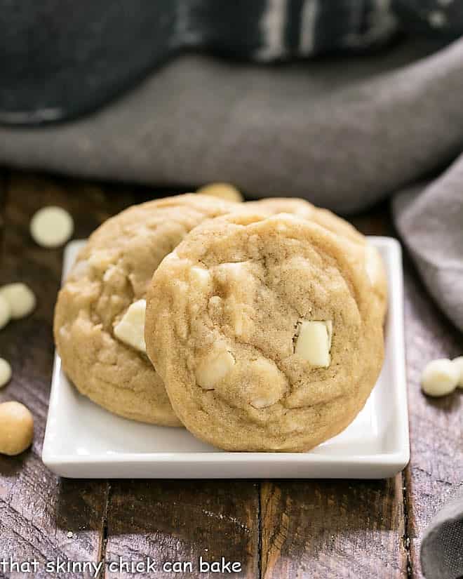 White Chocolate Macadamia Nut Cookies - The quintessential macadamia nut cookie recipe that will have you swooning!!! White Chocolate Macadamia Nut Cookies on a square white plate.