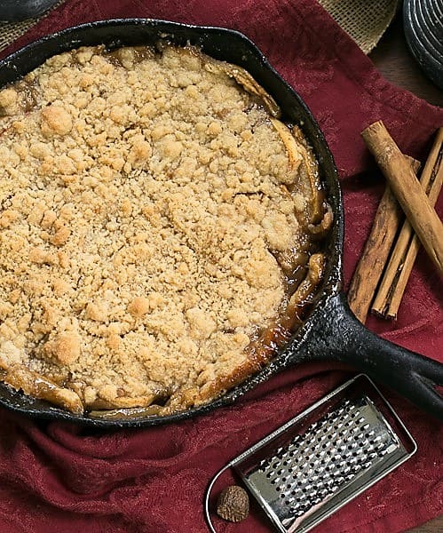 Grilled Apple Crisp - A classic dessert with smoky undertones from the BBQ Grilled Apple Crisp in a cast iron pan