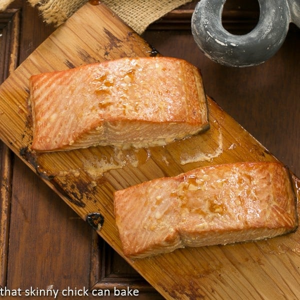 Grilled Cedar Plank Salmon flavored with a simple marinade then grilled for an elegant tasty seafood entree! Two fillets of Grilled Cedar Plank Salmon on a cedar plank