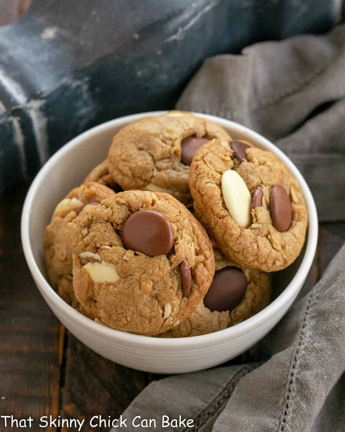 Triple Chocolate Chunk Oatmeal Cookies - Perfect treat for you cookie monsters! Homemade Oatmeal Cookies with Chocolate Chunks in a white bowl.