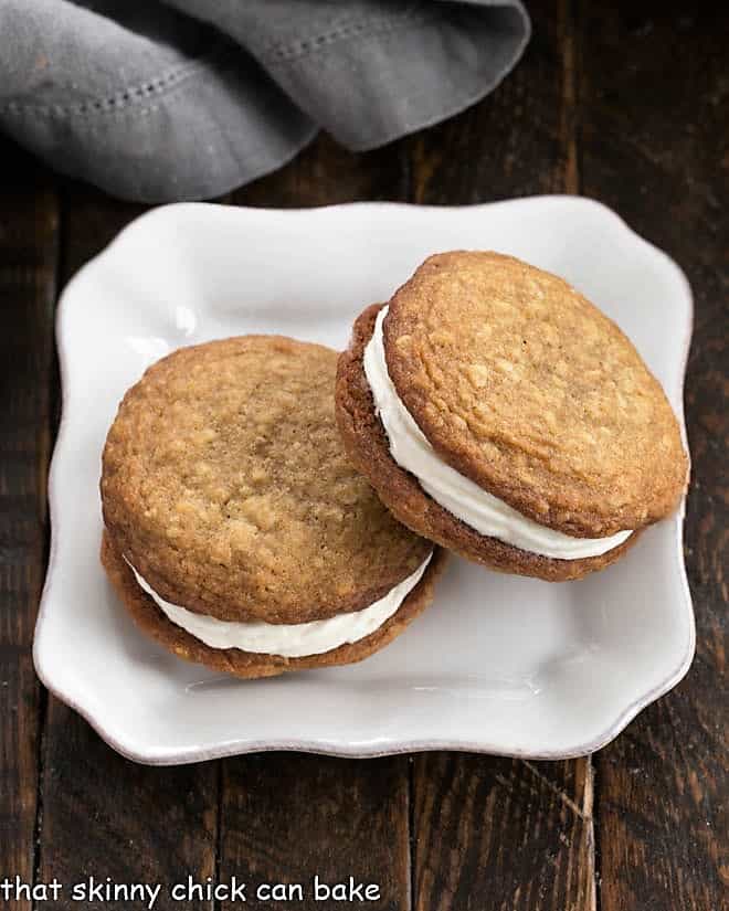 Overhead view of 2 Oatmeal Creme Pies on a square white plate