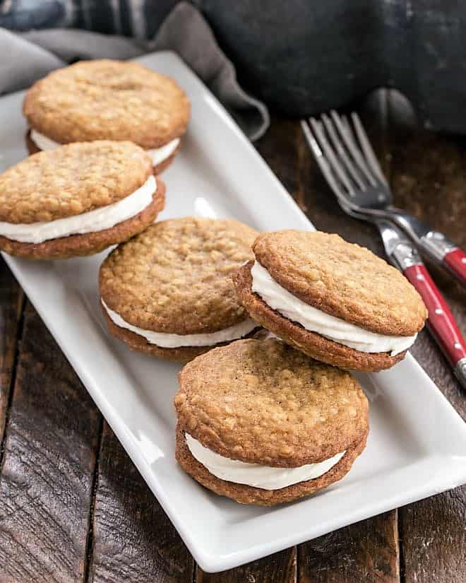 A white tray full of homemade Oatmeal Creme Pies.