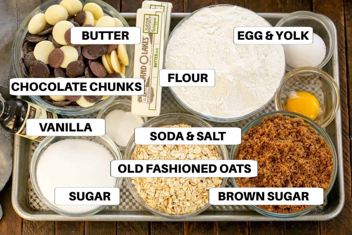 Oatmeal cookie ingredients. on a sheet pan with labels.