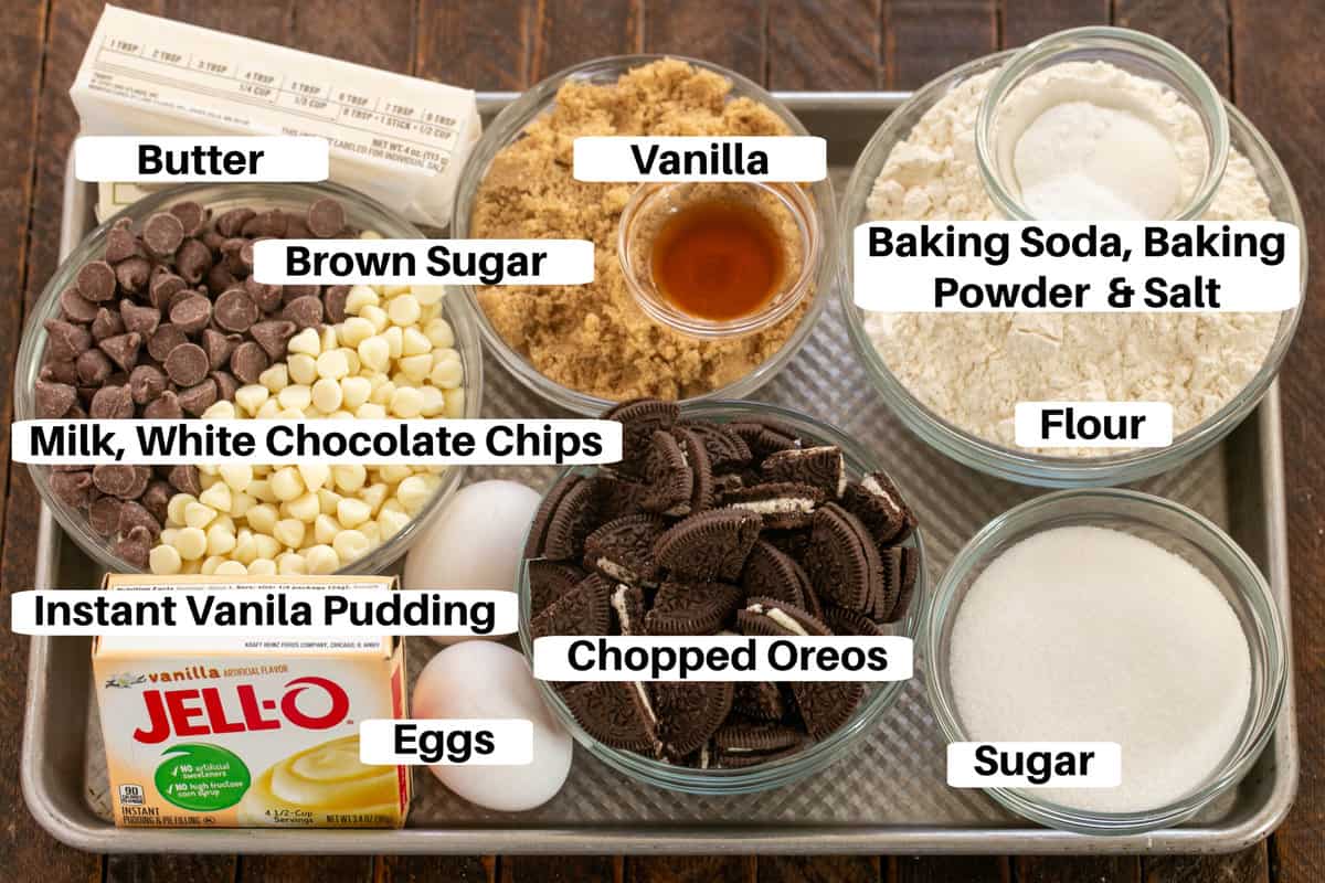 Oreo chocolate chip cookie bars ingredients with labels on a sheet pan.