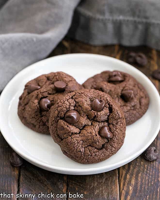 3 Double Chocolate Chunk Cookies on a white plate.