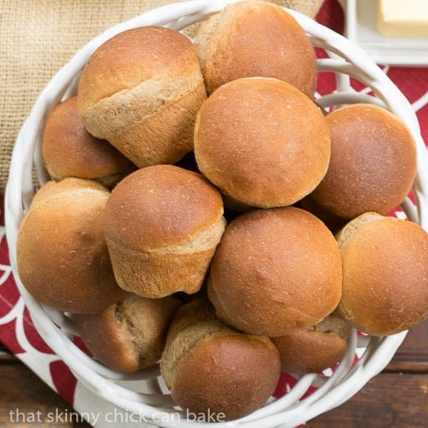 Whole Wheat Dinner Rolls in a ceramic basket.
